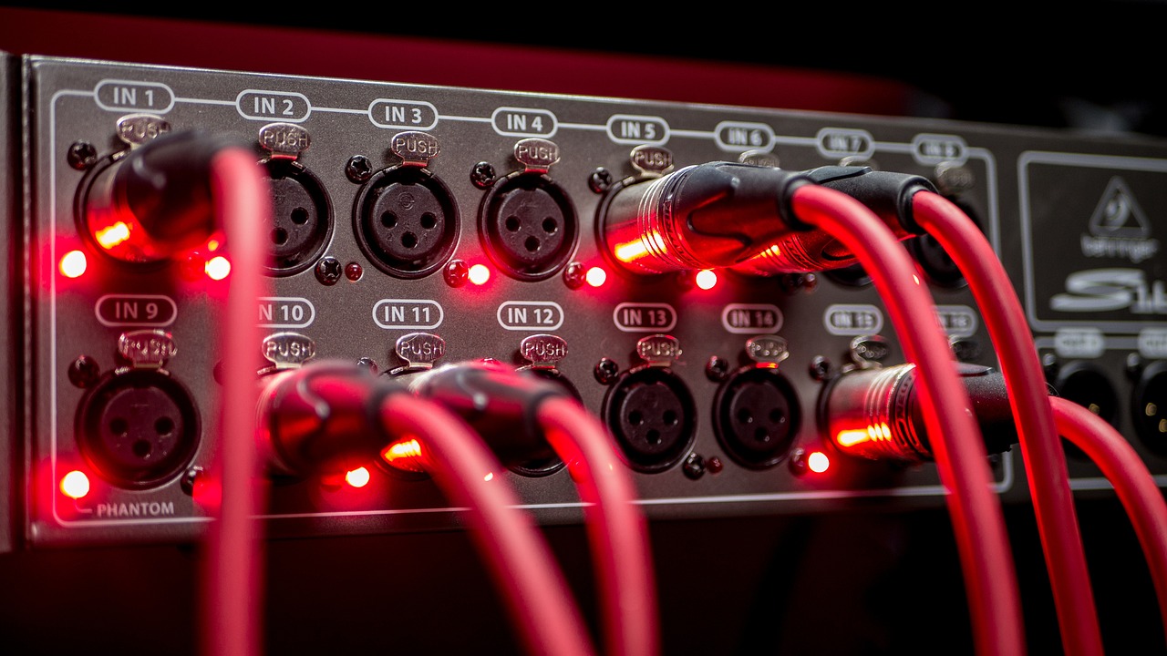 a close up of a bunch of red wires, by Ejnar Nielsen, shutterstock, concert light, control panels, high detail product photo, with professional lighting