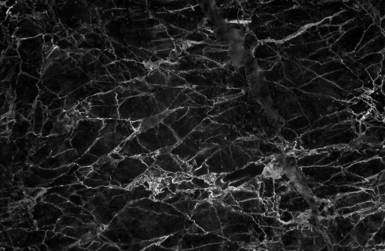 a close up of a black marble surface, a portrait, pexels, 1024x1024, difraction from back light, on a large marble wall, noir