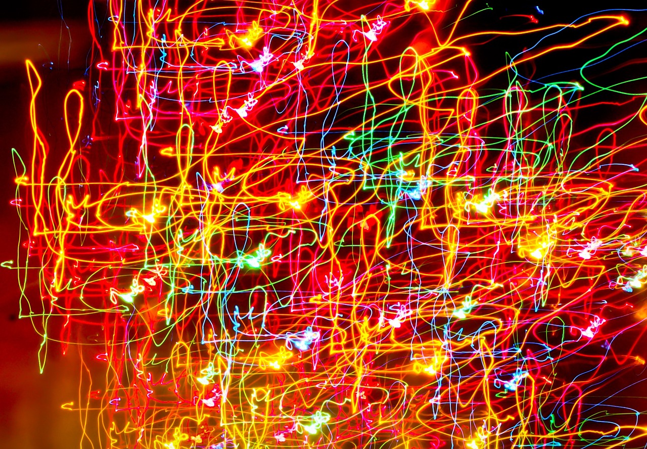 a close up of a christmas tree with many lights, a picture, inspired by Bruce Munro, lyrical abstraction, iphone wallpaper, neon graffiti, 50mp, neon!! light