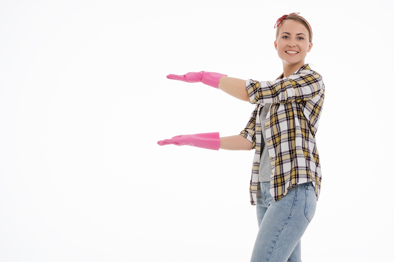 a woman in a plaid shirt and pink gloves, shutterstock, plasticien, his arms spread. ready to fly, on the white background, cleaning future, advertisement photo