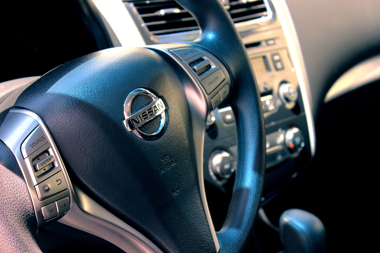 a close up of a steering wheel on a car, photo taken on a nikon, 3-dimensional, the, yoshida