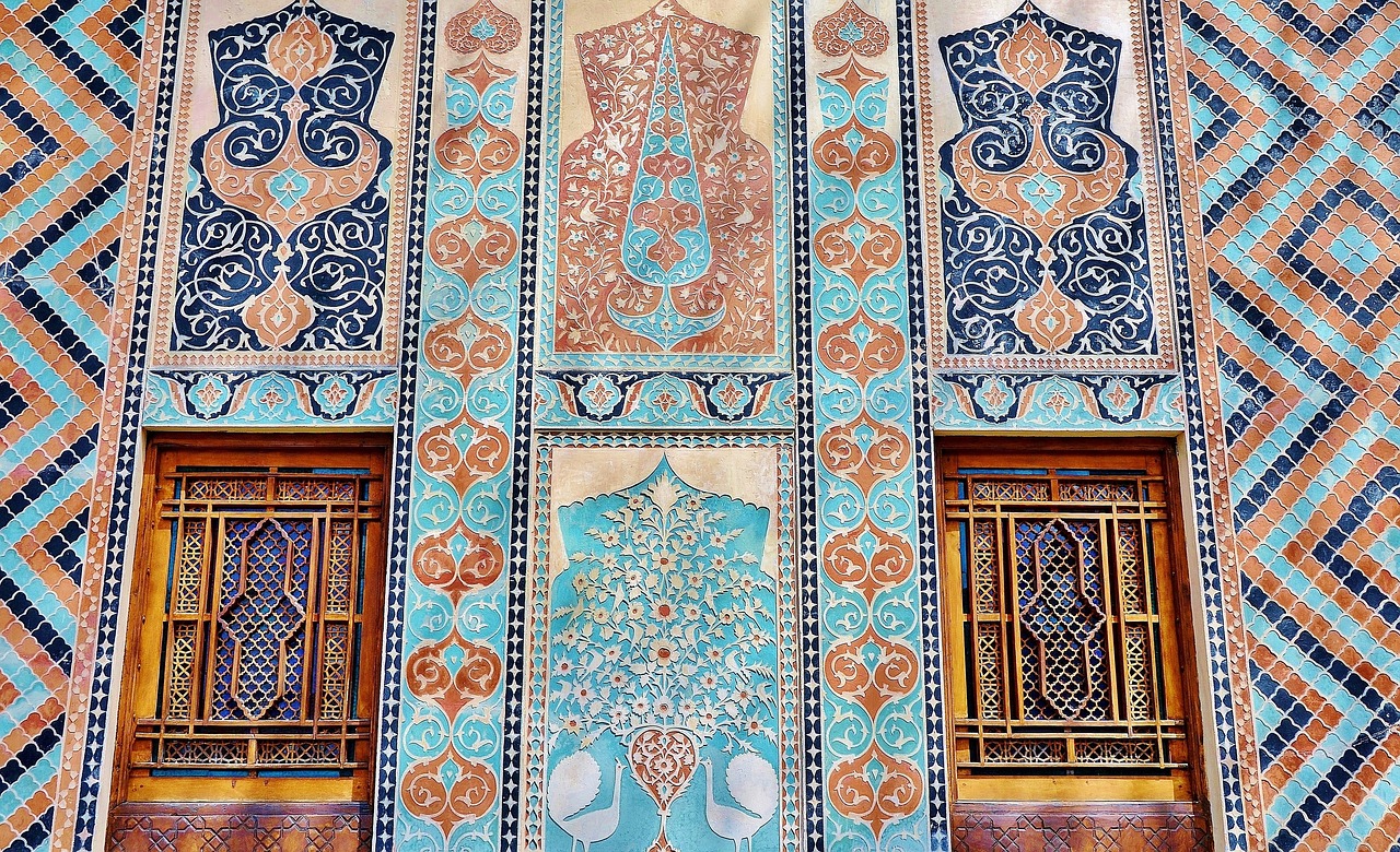 a close up of two windows on a building, a mosaic, inspired by Osman Hamdi Bey, arabesque, teal and orange color scheme, painting of samarkand, highly detailed panel cuts, intricate mural