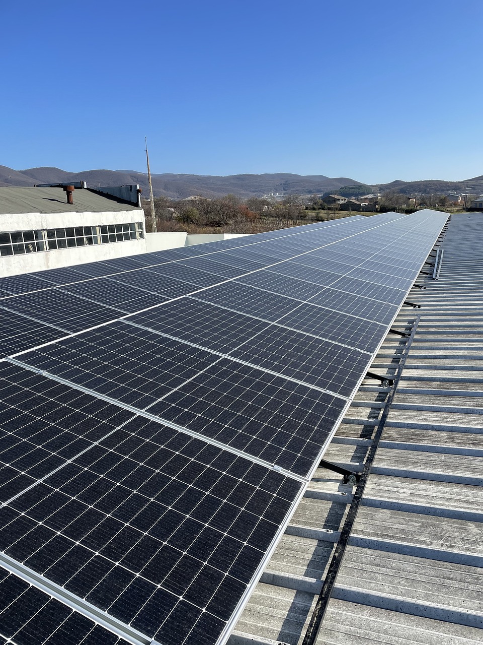 a solar array on the roof of a building, by Xul Solar, daoshi, full view, covered solar system, pp