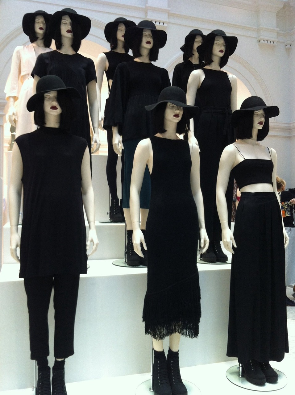 a group of mannequins wearing black dresses and hats, inspired by Vanessa Beecroft, tumblr, bauhaus, reminded me of the grim reaper, tall and lanky skinny, as wednesday addams, official jil sander editorial