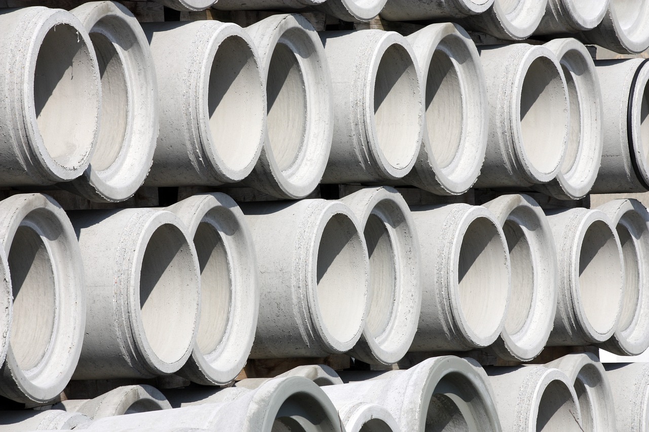a bunch of cement pipes stacked on top of each other, a photo, by John Murdoch, shutterstock, plasticien, close-up product photo, holes, white plastic, stock photo