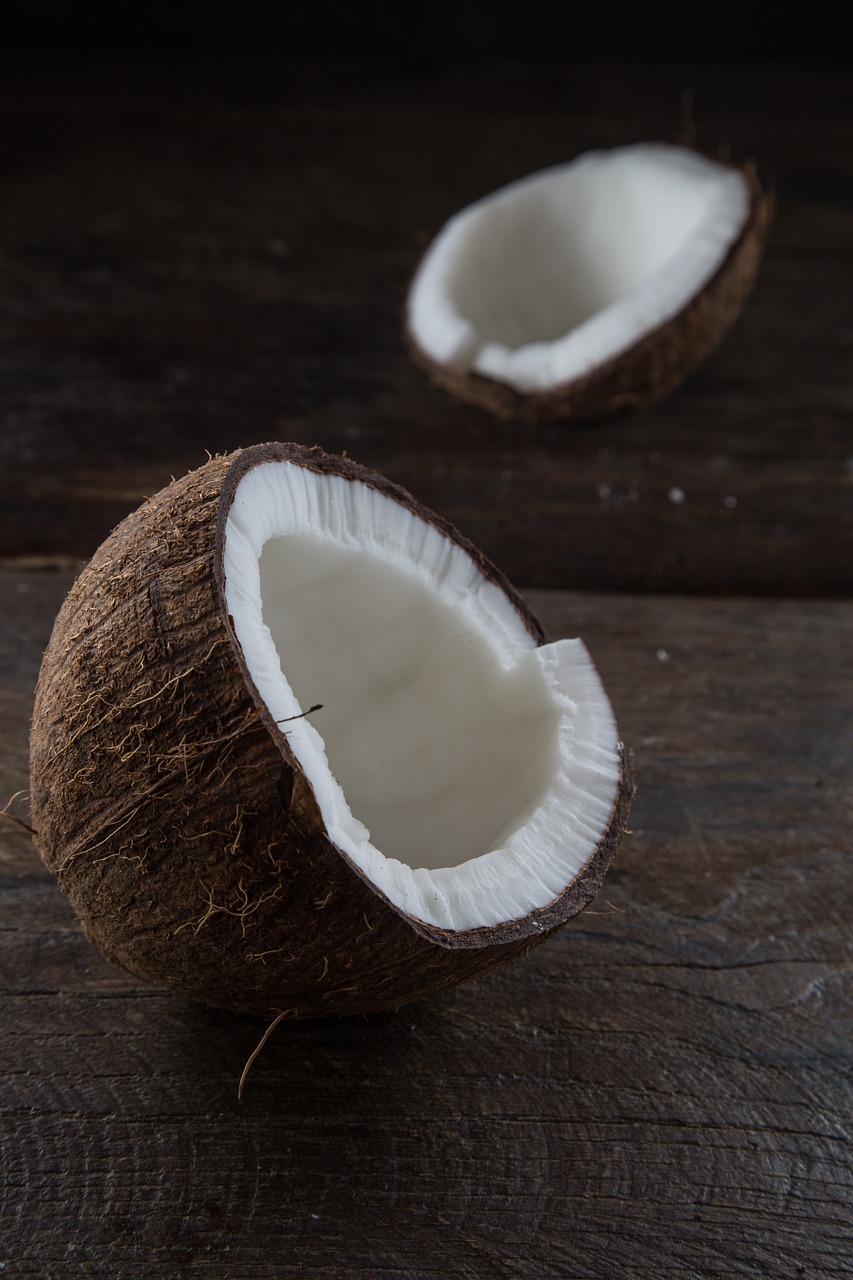 a half of a coconut sitting on top of a wooden table, by Johannes Martini, unsplash, hurufiyya, close-up product photo, panels, high quality product image”, test