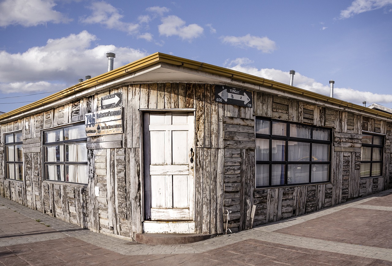 a small wooden building sitting on the side of a road, a portrait, old signs, tomas sanchez, high detailed photo, port