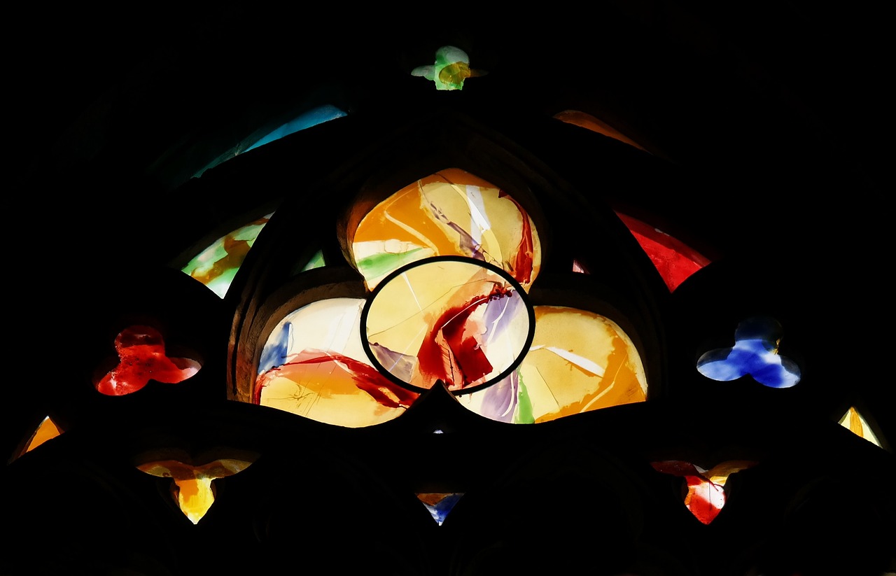 a close up of a stained glass window in a building, inspired by Johannes Itten, flickr, old masters light composition, fotografia, gaudi style”, obscured underexposed view