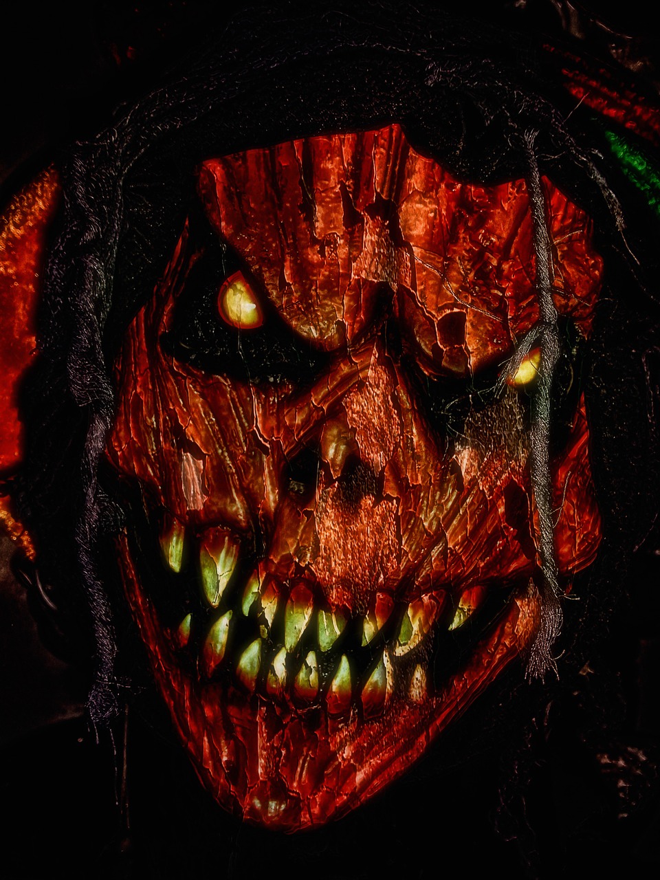 a close up of a scary face in the dark, a digital rendering, digital art, darksiders halloween theme, scarecrow, a devilish grin on his face, tortured face made of wood