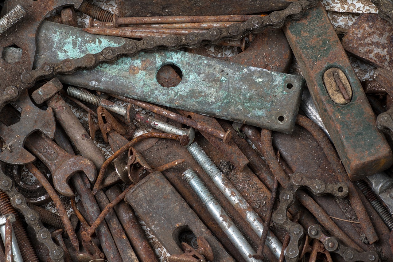 a pile of rusty tools sitting on top of a table, a portrait, chain, texture, 3 4 5 3 1, metal handles
