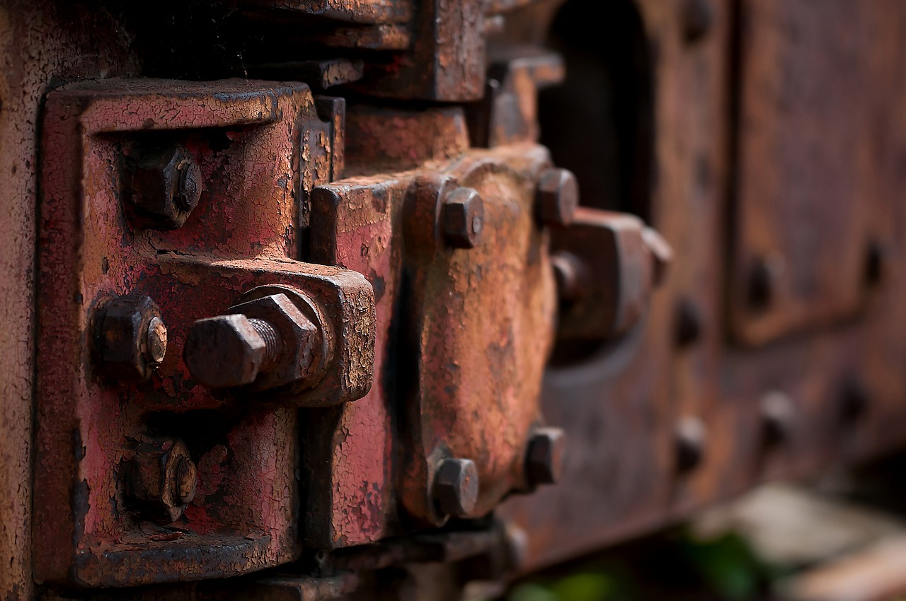 a close up of a rusted piece of metal, by Alexander Fedosav, biomechanical railroad, details and vivid colors, heavy depth of field, bolts