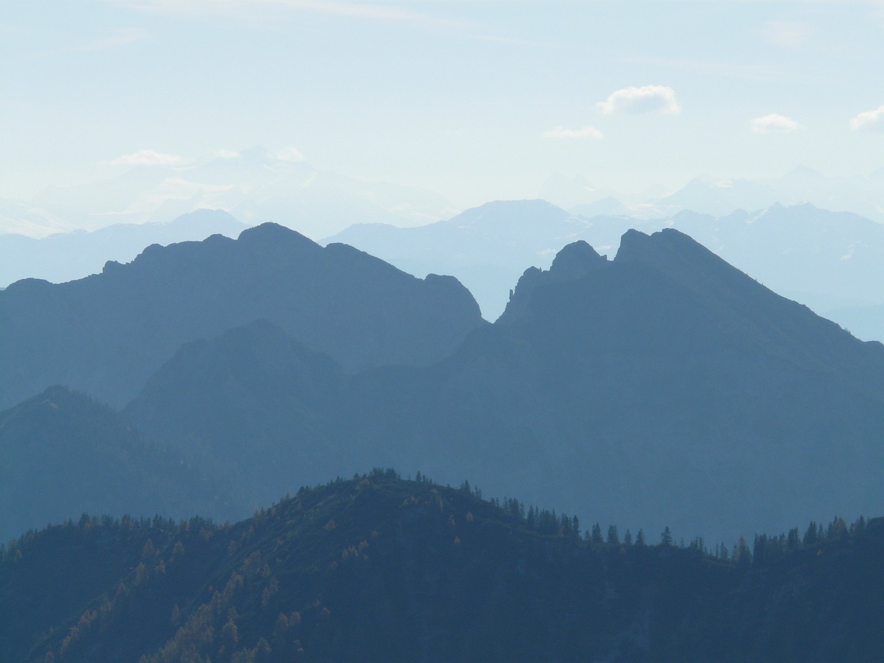 a plane is flying over a mountain range, a picture, by Werner Gutzeit, flickr, figuration libre, empire silhouette, autumn mountains, [ closeup ]!!, dark blue