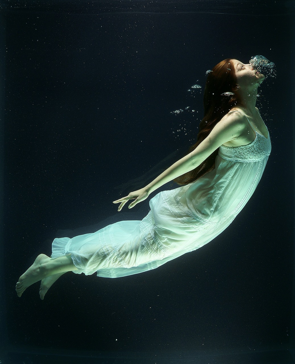 a woman in a white dress floating under water, flickr, [[fantasy]], [ [ hyperrealistic ] ], chris moore”, swimming in space