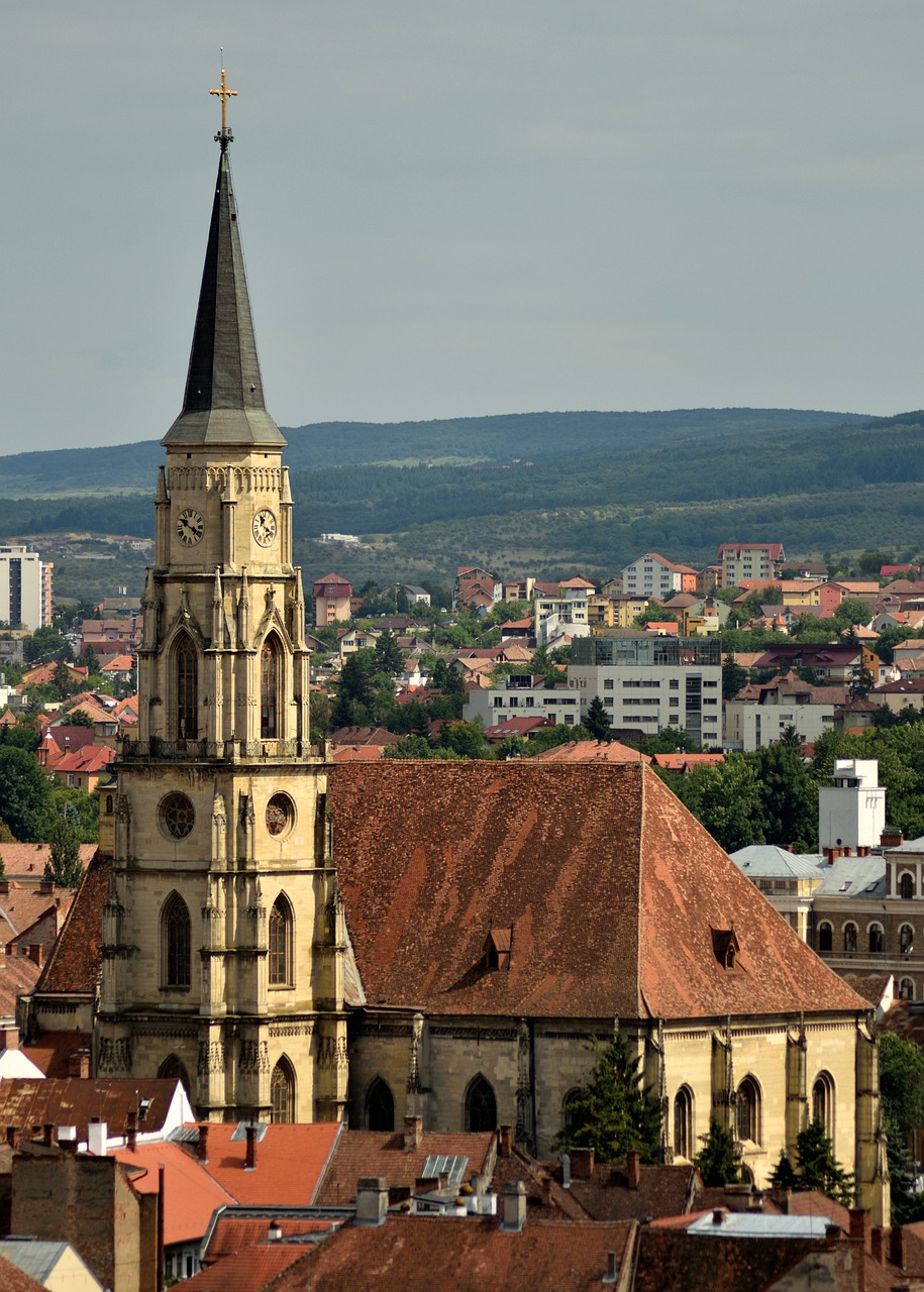 a very tall clock tower towering over a city, inspired by Ernő Tibor, shutterstock, romanesque, photographic isometric cathedral, photo taken with nikon d 7 5 0, transylvania, nice afternoon lighting