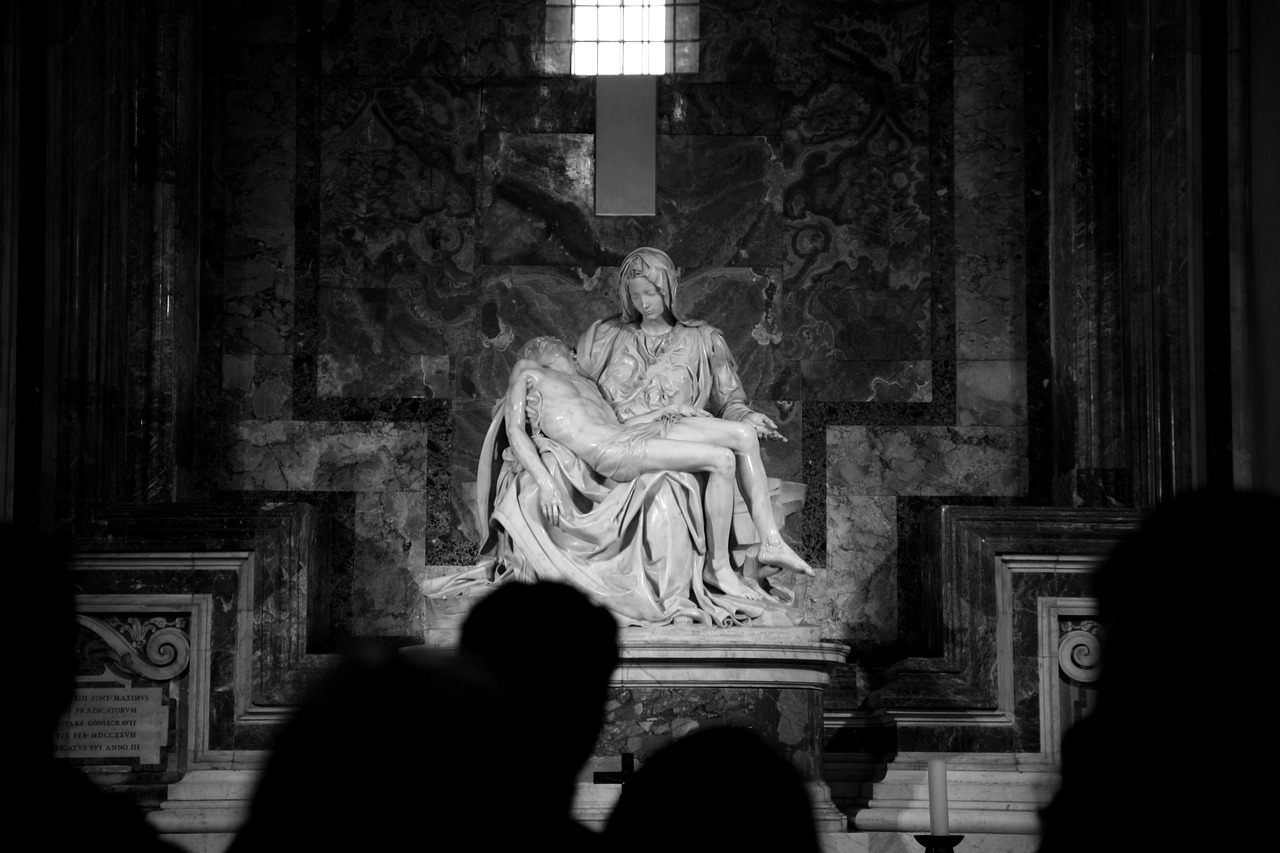 a black and white photo of a statue in a church, by Michaelangelo, couple, in the center of the frame, photo taken in 2018, audience