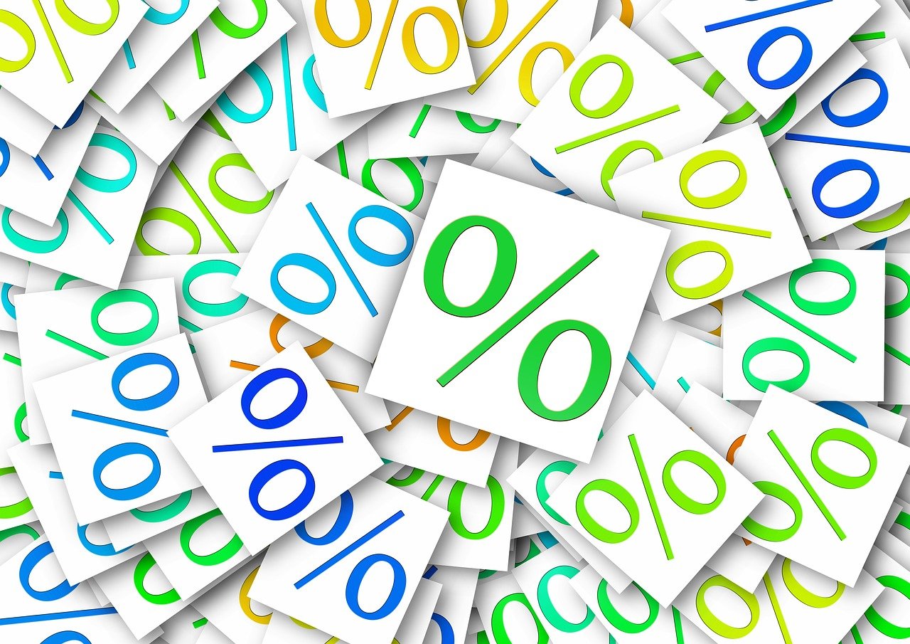 a pile of papers with colorful numbers on them, a stock photo, by Aleksander Kotsis, shutterstock, incoherents, 7 0 % ocean, golden ratio illustration, currency symbols printed, wallpaper - 1 0 2 4