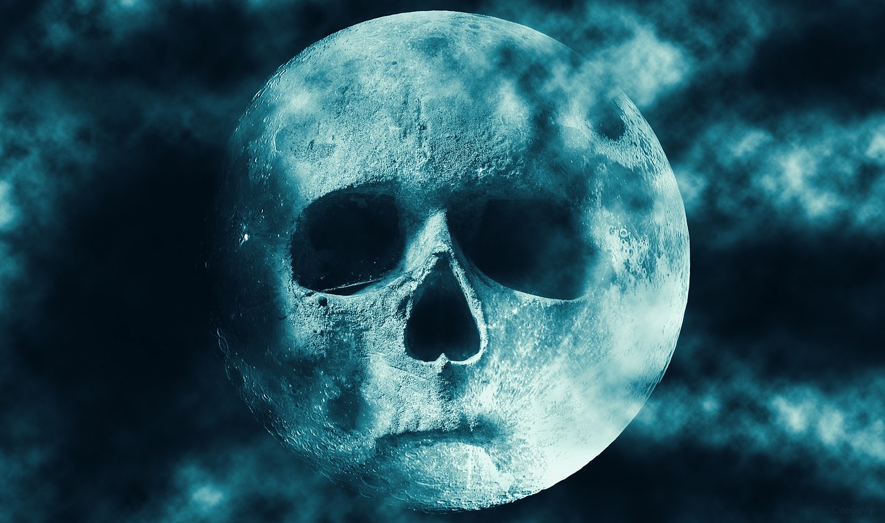 a close up of a full moon with a skull on it, digital art, trending on pixabay, digital art, turquoise blue face, in a space horror setting, avatar image, dark blue planet
