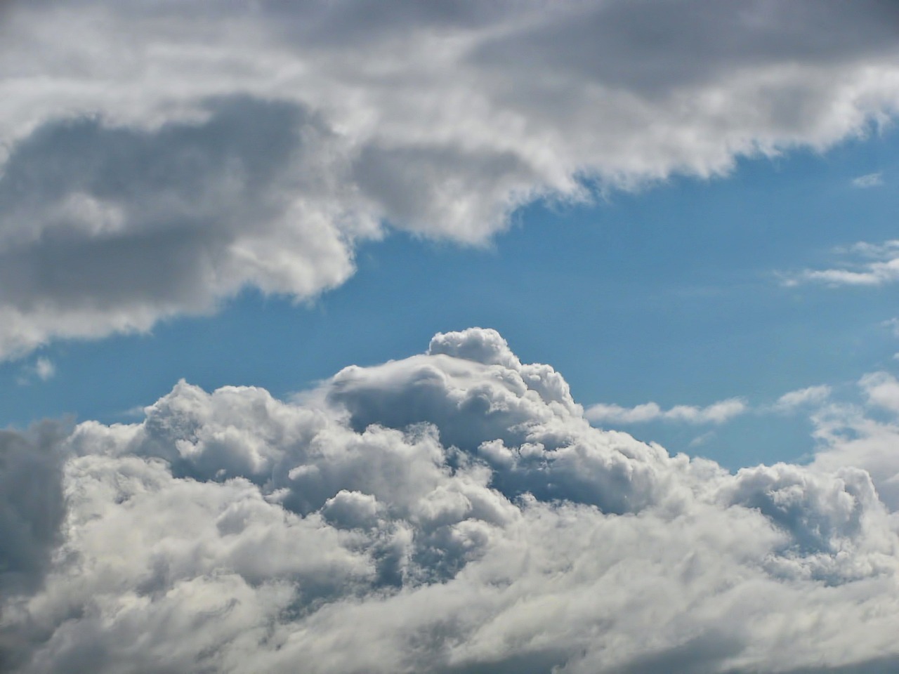 a large jetliner flying through a cloudy sky, precisionism, today\'s featured photograph 4k, tattoos of cumulus clouds, beautifull puffy clouds. anime, cumulus clouds