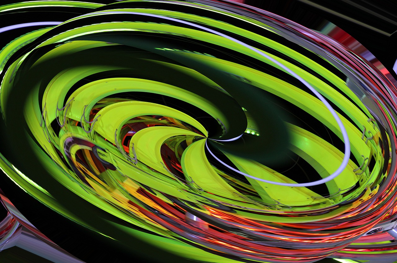 a close up of a colorful object on a table, flickr, abstract illusionism, crazy racer spinning, green neon signs, photo taken with canon 5d, twirly