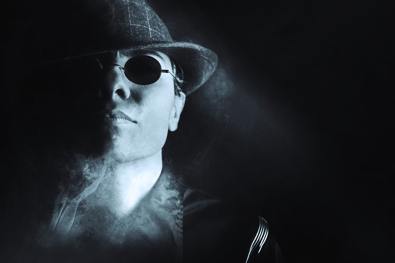 a black and white photo of a man wearing a hat and sunglasses, inspired by Evaline Ness, digital art, background ( smoke, flash photo, blue steel, dramatic lighting. stylized