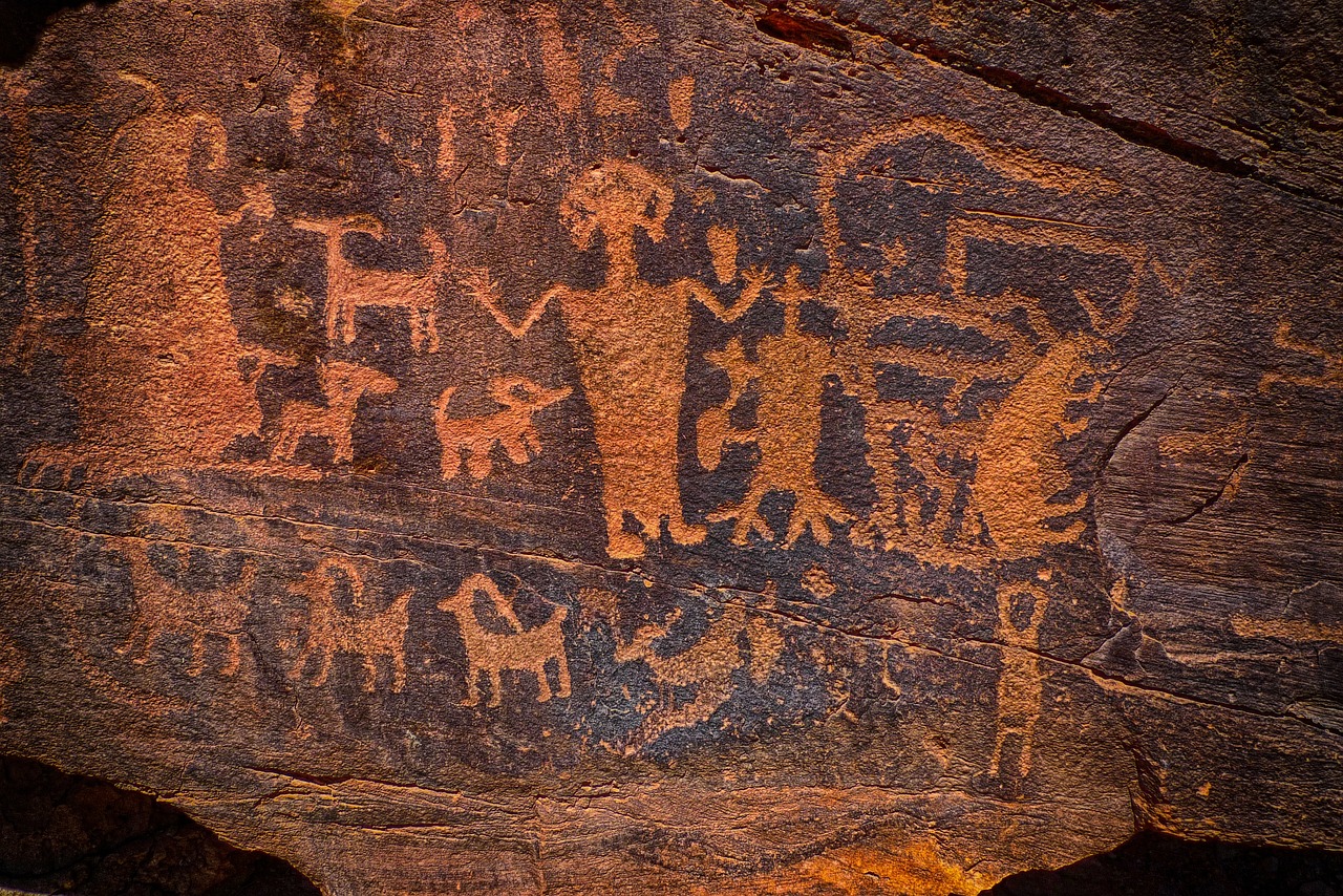a close up of a rock with a painting on it, a cave painting, by Don Reichert, trending on pixabay, american scene painting, populated with aliens and people, red sandstone natural sculptures, intricate writing, 1800s painting