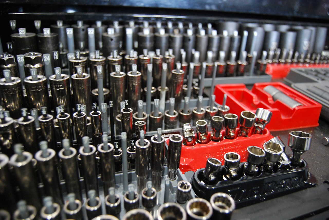 a bunch of tools sitting on top of a table, chrome tubes, extremely intricate high detail, up close picture, rack