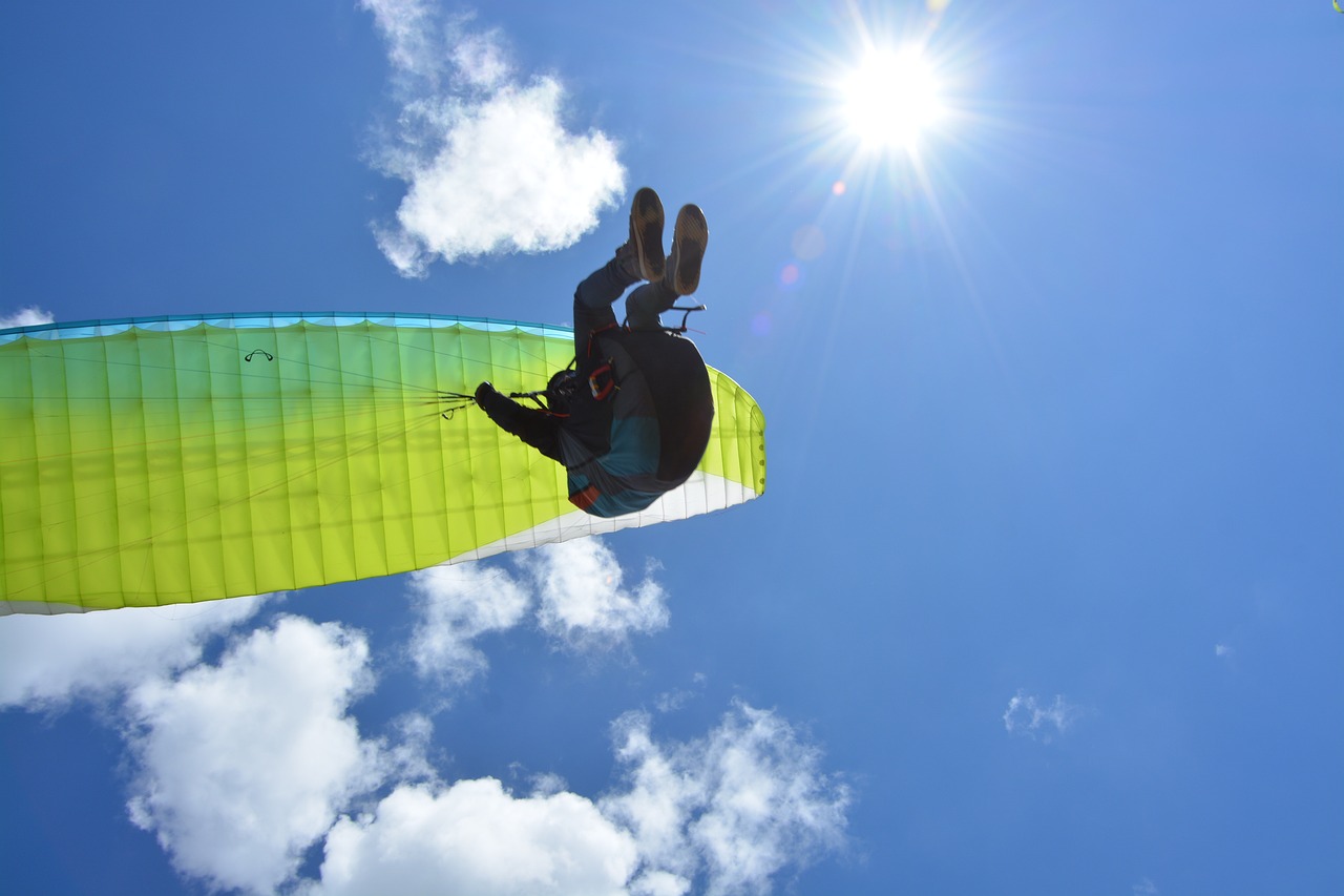 a person that is in the air with a parachute, a picture, by Alison Watt, shutterstock, afternoon sunshine, pulling the move'derp banshee ', a green, high details!