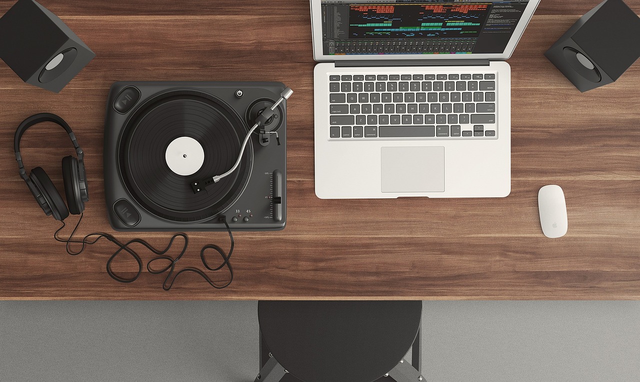 a laptop computer sitting on top of a wooden desk, a computer rendering, by Kurt Roesch, turntables, flat lay, istock, dj mixer