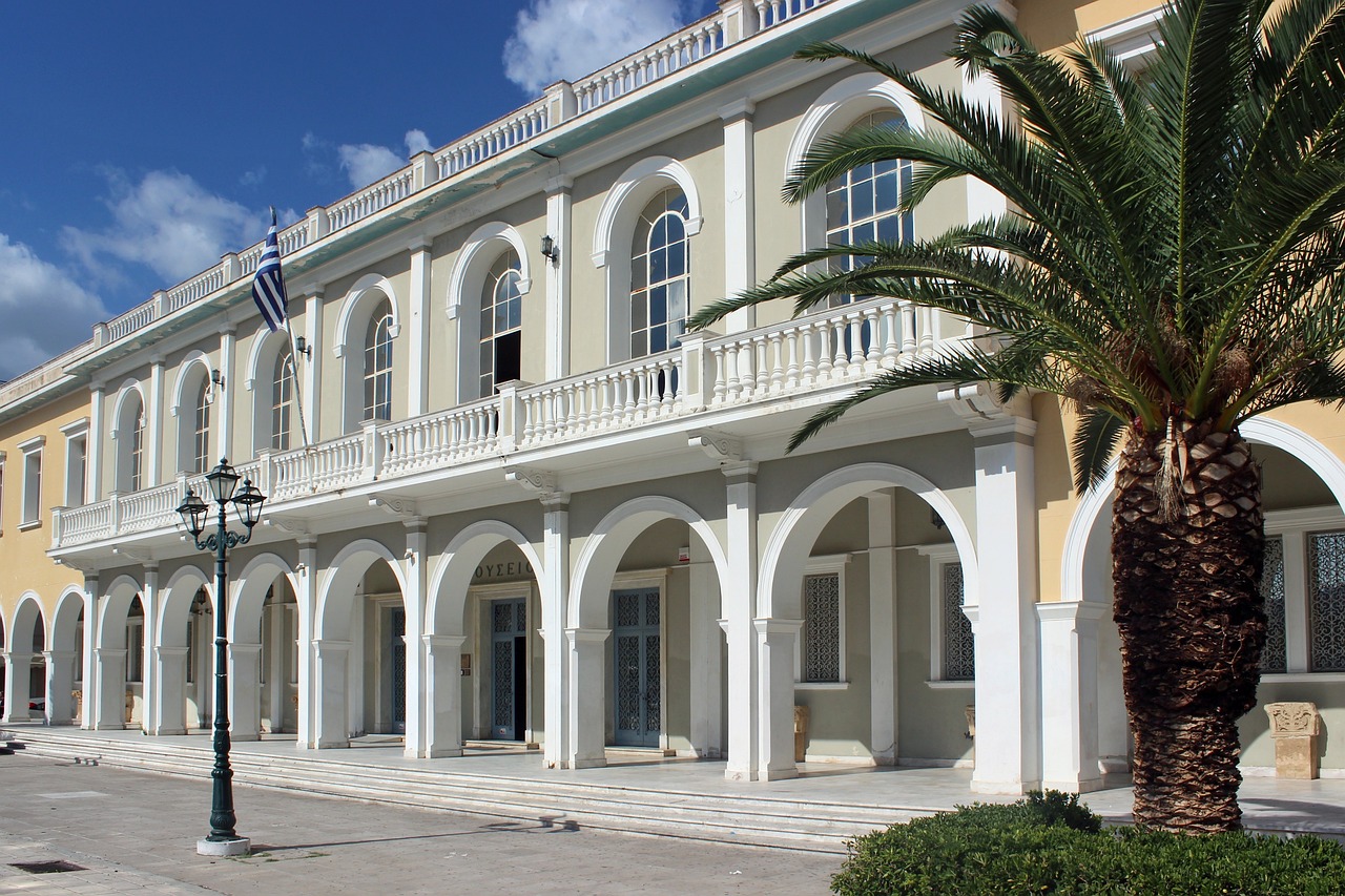 a building with a palm tree in front of it, a picture, inspired by Antonín Chittussi, shutterstock, neoclassicism, war theatre, george patsouras, town hall, seaside