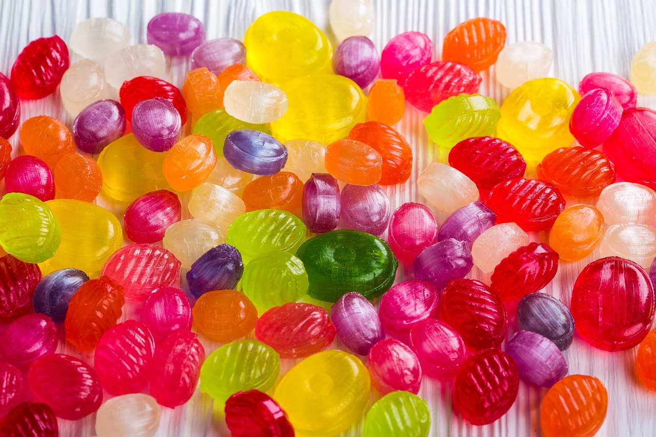 a pile of jelly candy sitting on top of a table, a stock photo, by Alma Thomas, pexels, plasticien, with colorfull jellybeans organs, fun - w 704, wallpaper - 1 0 2 4, candy girl