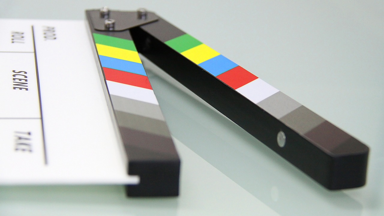 a close up of a movie clapper on a table, by Ludovit Fulla, multi - coloured, nicovideo, casting, movie frame