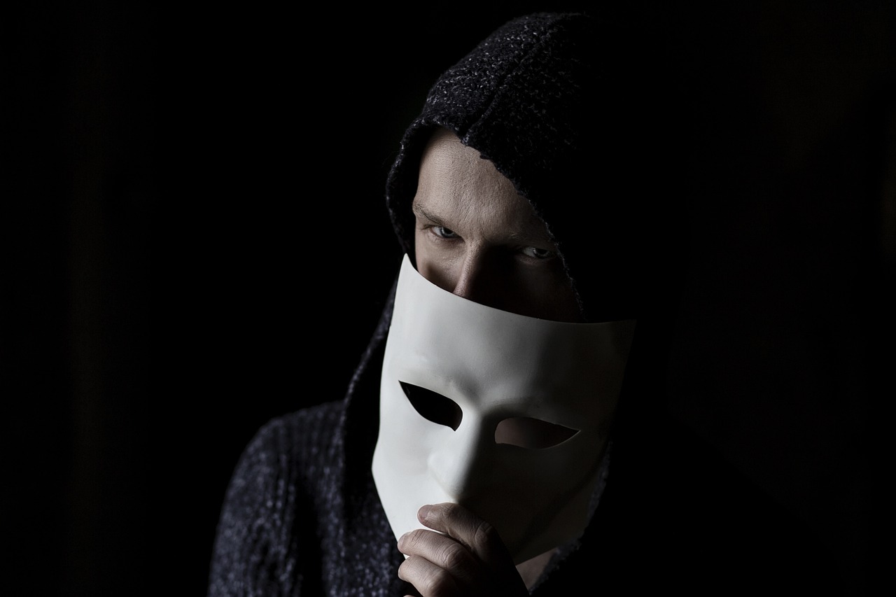 a man with a white mask covering his face, antipodeans, beginner, hamlet, stealth, teenager