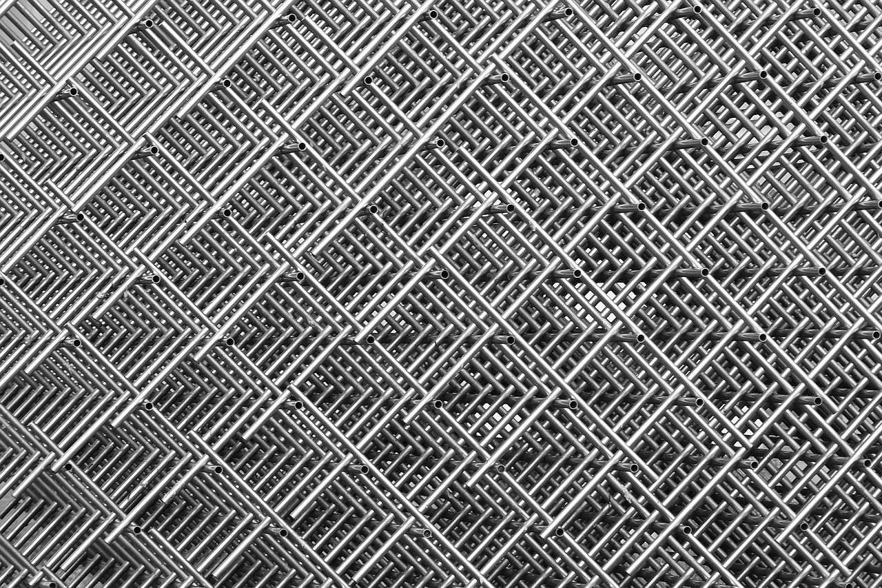 a black and white photo of a chain link fence, a stipple, by Werner Gutzeit, unsplash, op art, square lines, stacked, stainless steel, industrial background