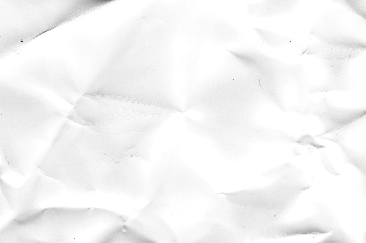 a black and white photo of a crumpled piece of paper, by Andrei Kolkoutine, tumblr, fine art, gradient white to silver, phone background, spots, 1 2 k