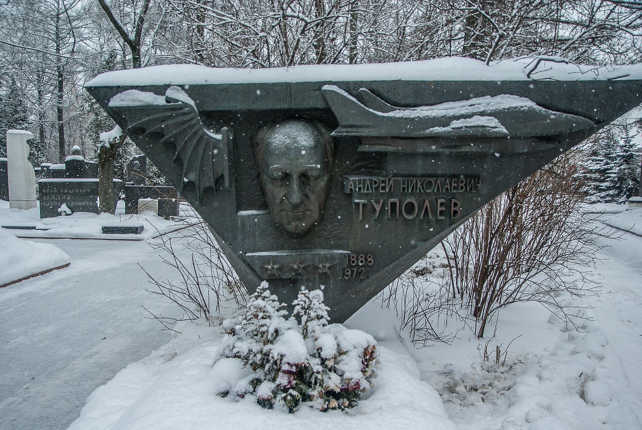 a monument in the middle of a snowy cemetery, inspired by Mikhail Yuryevich Lermontov, flickr, socialist realism, winged head, tyler, the tunnel into winter, against a winter garden