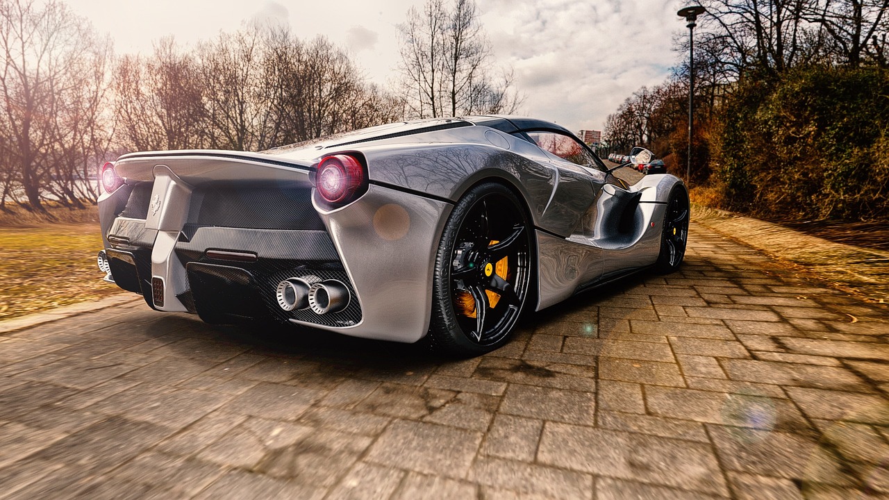 a silver sports car parked on the side of a road, a picture, by Ivan Grohar, shutterstock, hyperrealism, ferrari, marble!! (eos 5ds r, back light, f12