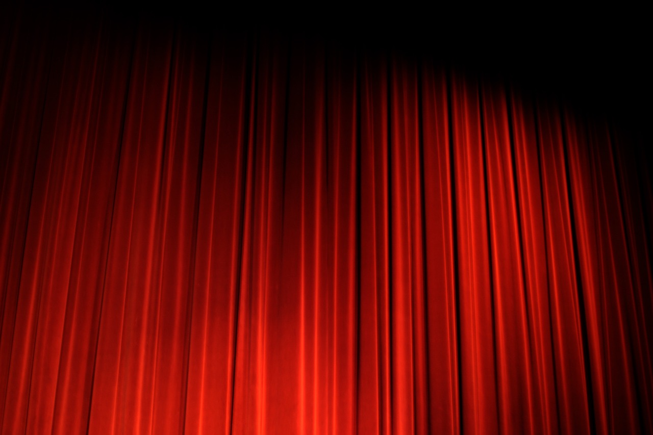 a red curtain in front of a black background, a picture, by Edward Corbett, recital, backroom background, information, warm and joyful atmosphere