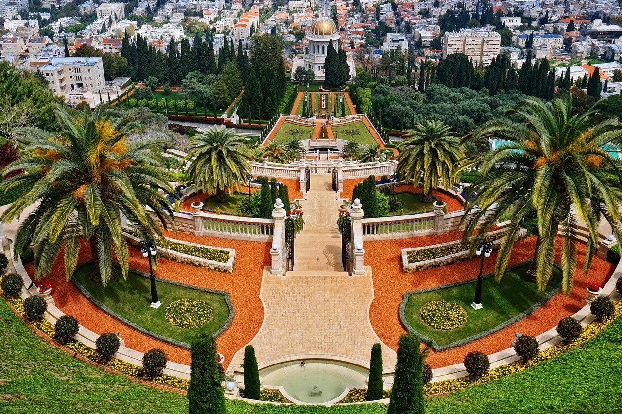 a view of a city from the top of a hill, a tilt shift photo, by Emanuel Witz, shutterstock, renaissance, manicured garden of eden, with palm trees and columns, hebrew, gardens with flower beds