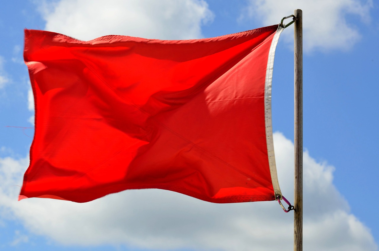 a red flag blowing in the wind against a blue sky, by John Murdoch, symbolism, dingy, red river, rectangle, all red