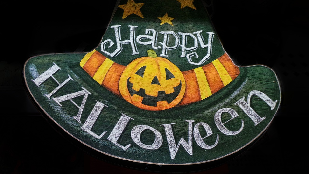 a happy halloween hat with a jack - o'- lantern on it, a photo, pixabay, lowbrow, pub sign, middle close up shot, 🌻🎹🎼, view from bottom to top