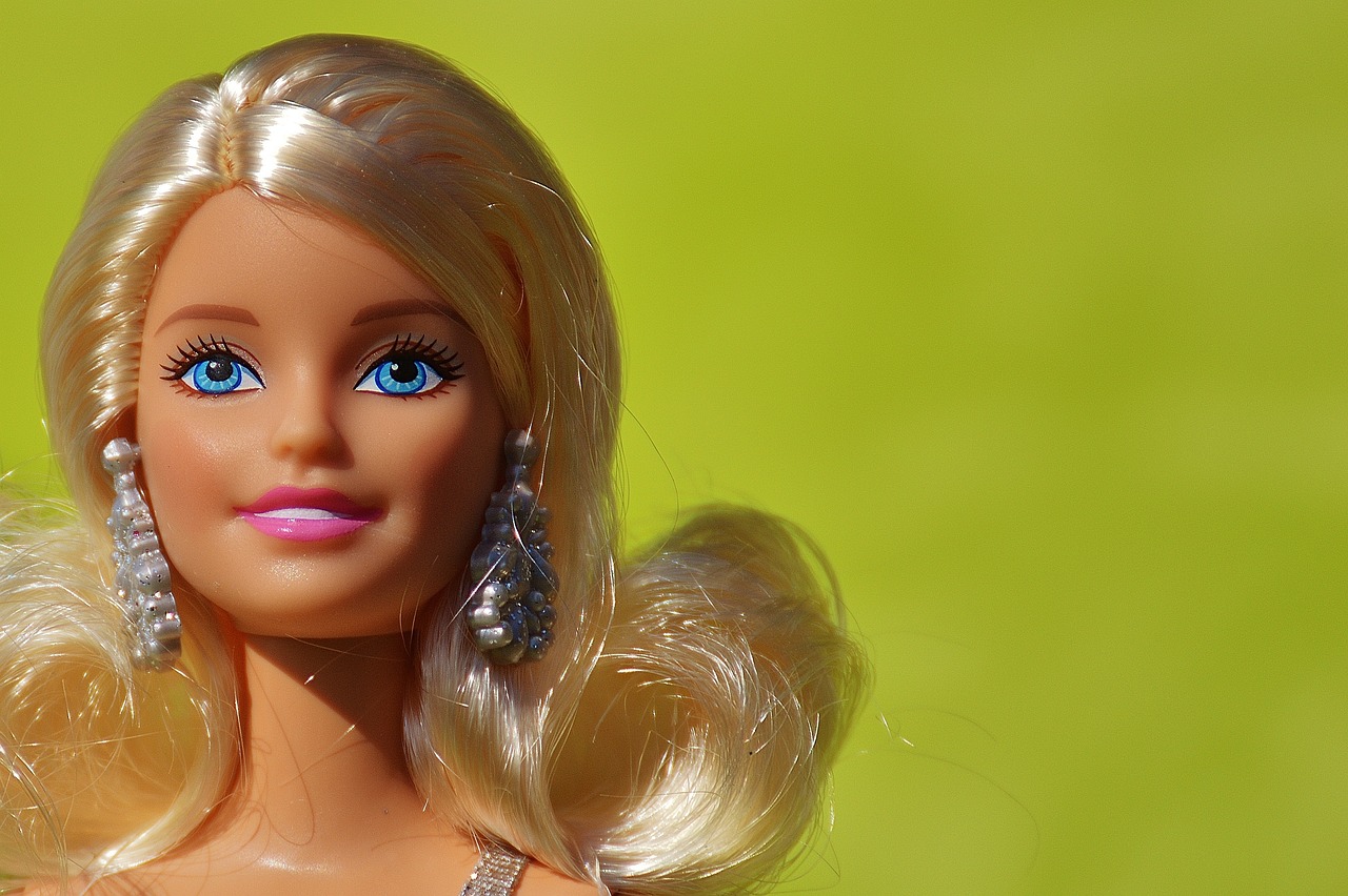 a barbie doll with blonde hair and blue eyes, by Tom Carapic, pixabay, toy commercial photo, close up portrait photo, cartoonish, photorealism. trending on flickr