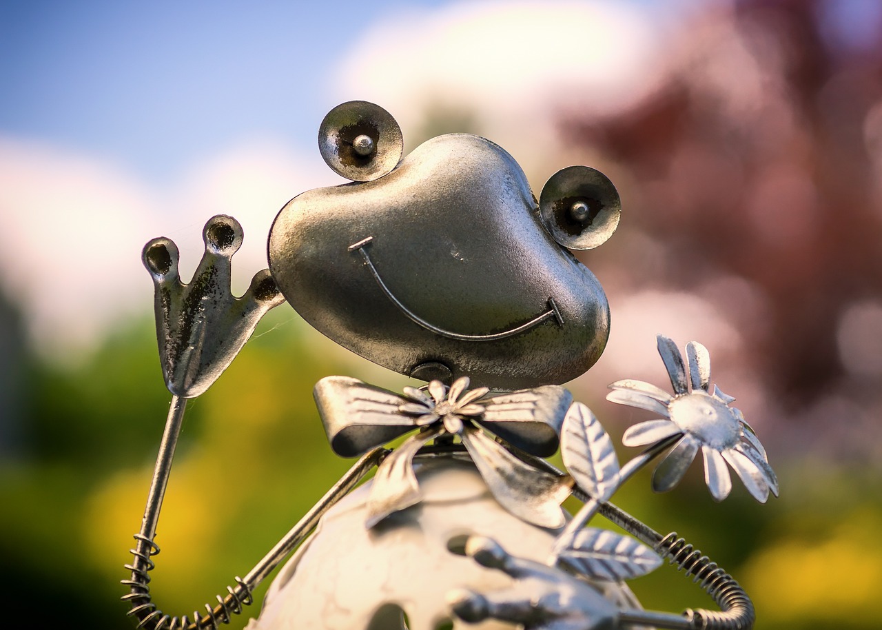 a metal frog figurine holding a flower, digital art, beautiful sunny day, closeup - view, smiling, zoom shot