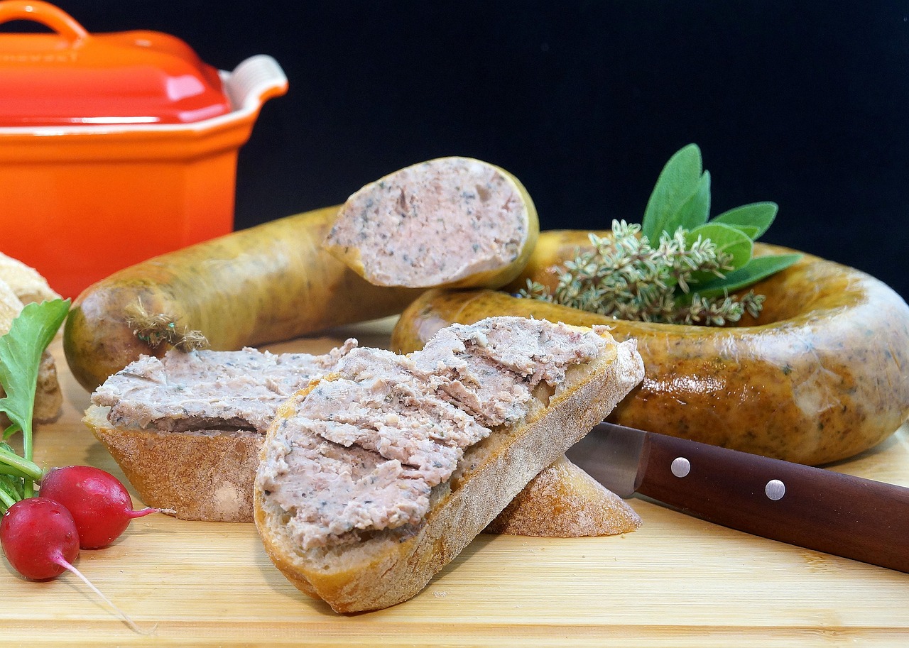 a wooden cutting board topped with meat and vegetables, inspired by Eugène Boudin, figuration libre, very high quality, sausages, mason, photo mid shot