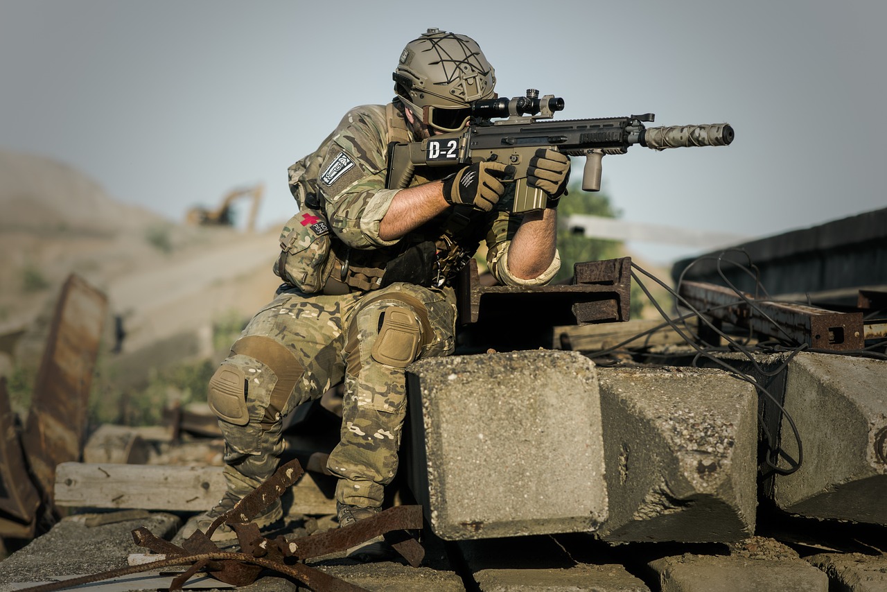 a man in camouflage holding a machine gun, by Dietmar Damerau, shutterstock, cobra, battle action shot, 6 0 mm lens in full armor, 8k octan photo, military outpost