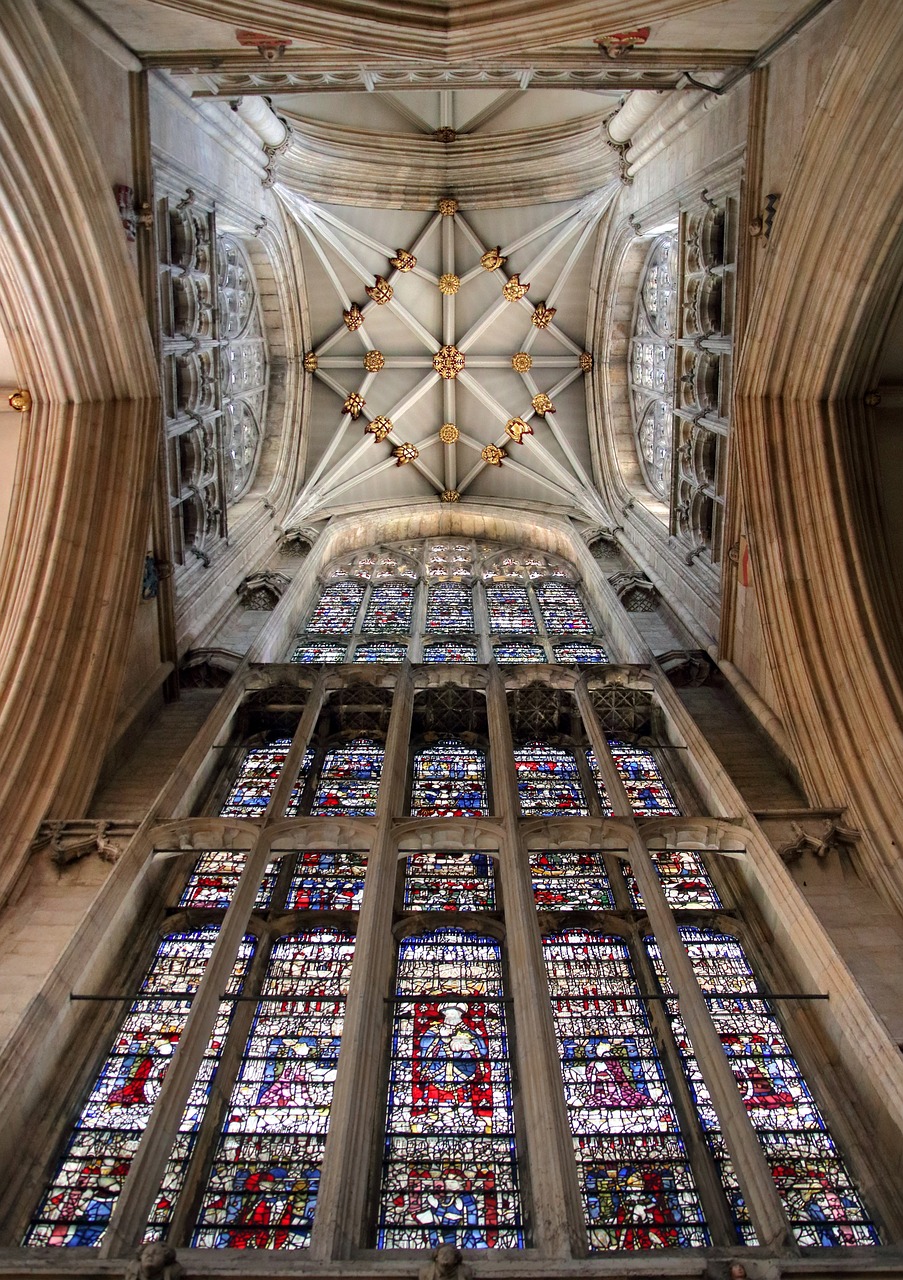 a large stained glass window inside of a building, by Edward Clark, renaissance, towering high up over your view, alabaster gothic cathedral, england, wide angle photography