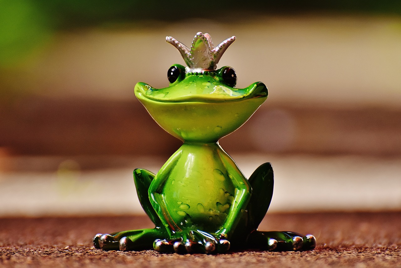 a green frog with a crown on its head, pixabay contest winner, resine figure, 😃😀😄☺🙃😉😗, silver, cutie