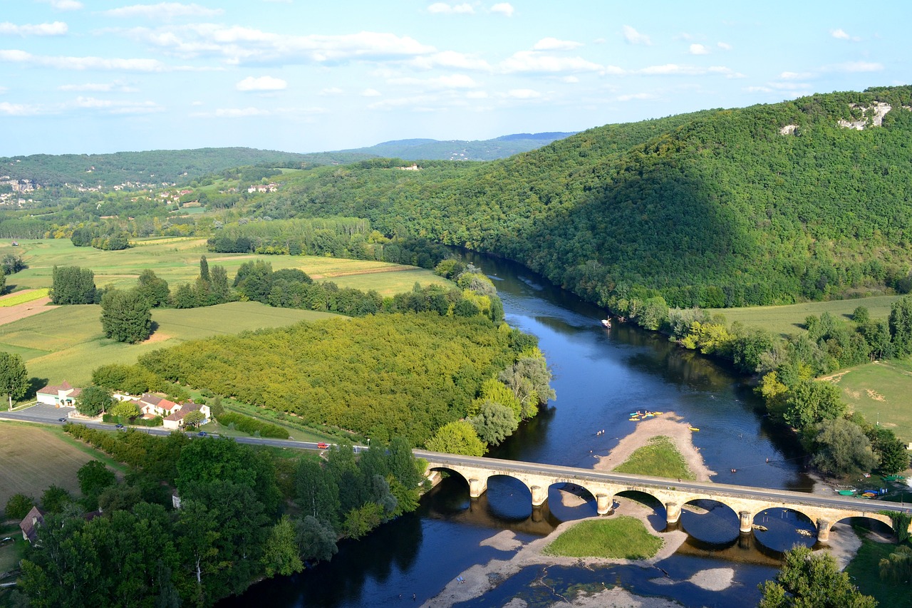 an aerial view of a bridge over a river, by François Girardon, flickr, les nabis, river and trees and hills, cornell, panoramic shot, sandra chevier