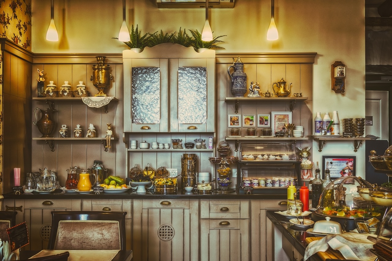 a kitchen filled with lots of clutter and dishes, by Etienne Delessert, pexels, colonial style, breakfast buffet, the room is raucous and joyful, shelves