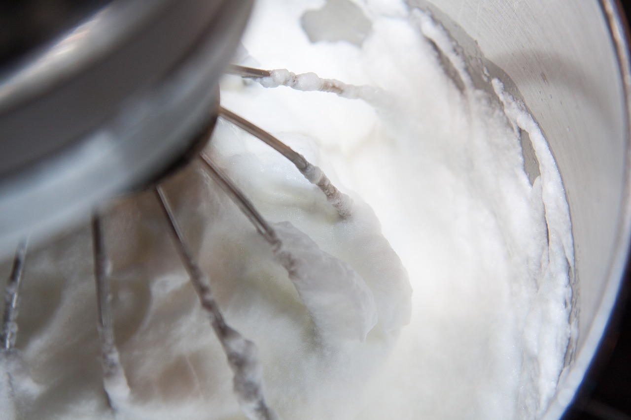 a close up of a whisk in a bowl, by Elizabeth Charleston, process art, dry ice, coconuts, closeup - view, satin