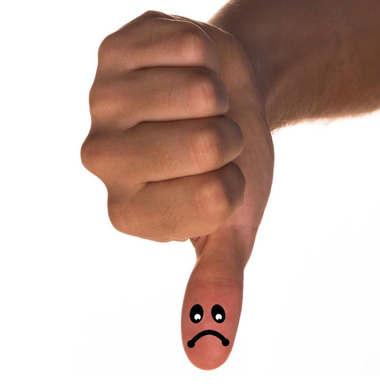 a finger with a sad face drawn on it, a picture, shutterstock, giving a thumbs up to the camera, on a white background, arms down, bad composition
